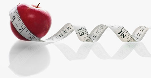 tape measure and apple